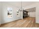 Bright dining room with modern chandelier and view to the adjacent wet bar at 6214 Talmadge Nw Way, Acworth, GA 30101