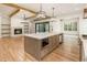 Bright, open kitchen with large island, modern appliances, and wood accents at 6214 Talmadge Nw Way, Acworth, GA 30101