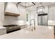 Modern kitchen with white cabinets, quartz countertops, gold faucet, and stainless steel appliances at 6214 Talmadge Nw Way, Acworth, GA 30101