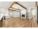 Spacious living room with fireplace, built-in shelving, wood beams, and hardwood floors at 6214 Talmadge Nw Way, Acworth, GA 30101