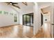 Spacious main bedroom with vaulted ceilings, wood floors, and access to a private balcony at 6214 Talmadge Nw Way, Acworth, GA 30101
