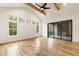Main bedroom with fireplace, wood floors, and sliding glass door leading to a private balcony at 6214 Talmadge Nw Way, Acworth, GA 30101