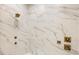 Modern shower with marble tile and gold fixtures at 6214 Talmadge Nw Way, Acworth, GA 30101