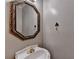 Powder room with ornate mirror and pedestal sink at 1081 Talon Trce, Lawrenceville, GA 30043