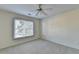 Bright bedroom with ceiling fan and large window at 1081 Talon Trce, Lawrenceville, GA 30043