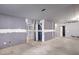 Unfinished basement space with drywall and concrete flooring at 3075 Heather Stone Way, Lawrenceville, GA 30043