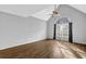 Spacious living room with vaulted ceiling, arched window, and wood-look flooring at 3075 Heather Stone Way, Lawrenceville, GA 30043