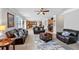 Open concept living room and kitchen with brown leather furniture at 300 Meadowwood Cir, Woodstock, GA 30188