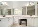 Bright primary bathroom with double vanity, large mirror, and white cabinetry at 3334 Peachtree Ne Rd # 908, Atlanta, GA 30326