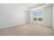 Spacious, unfurnished bedroom with neutral carpeting and a large window with shutters at 3334 Peachtree Ne Rd # 908, Atlanta, GA 30326