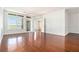 Spacious living room with hardwood floors, large windows, and sliding glass door at 3334 Peachtree Ne Rd # 908, Atlanta, GA 30326