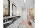 Modern bathroom featuring dual vanities, a glass shower, and a soaking tub at 2795 Peachtree Ne Rd # 1009, Atlanta, GA 30305