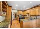 Kitchen with granite countertops and wood cabinets at 1095 Chestnut Hill Sw Cir, Marietta, GA 30064