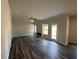 Spacious living room with wood-look flooring, fireplace, and natural light at 5032 Falcon Pt, Douglasville, GA 30135