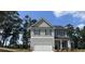 New two-story home with gray siding, dark roof, and two-car garage at 5110 Black Bear Trl, Douglasville, GA 30135