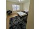 Cozy bedroom with wood-look flooring, large window, and plush rug at , Roswell, GA 30076