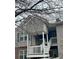 Exterior view of a two-story condo with a balcony and stairs at , Roswell, GA 30076