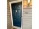 Front door of the condo unit with a dark blue door and house number 460 at , Roswell, GA 30076