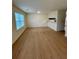 Another view of the living room showing its open layout and wood-look flooring at , Roswell, GA 30076
