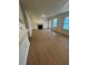 Spacious living room with wood-look flooring, fireplace, and access to a balcony at , Roswell, GA 30076