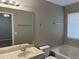 Bathroom with soaking tub, single vanity, and neutral-toned finishes at 113 Ellis Dr, Conyers, GA 30012