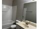 Bathroom featuring a bathtub, vanity sink, and a large mirror at 113 Ellis Dr, Conyers, GA 30012