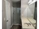 Clean bathroom with shower, vanity sink, and large mirror at 113 Ellis Dr, Conyers, GA 30012