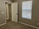 Unfurnished bedroom with carpet flooring and natural light at 113 Ellis Dr, Conyers, GA 30012
