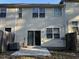Back exterior of the home with a small patio area at 113 Ellis Dr, Conyers, GA 30012