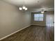 Open-concept living and dining space with new flooring at 113 Ellis Dr, Conyers, GA 30012