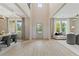 View of foyer with two-story ceiling, staircase, front door, and natural light at 27 Homesite Compass Rd, Hampton, GA 30228