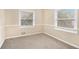 Well-lit bedroom with neutral walls and carpeted floors at 3435 Misty Valley Rd, Decatur, GA 30032