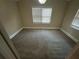 Bedroom with plush carpet, neutral walls, and bright windows at 3435 Misty Valley Rd, Decatur, GA 30032