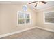 Bright bedroom with carpeted floor and multiple windows at 3435 Misty Valley Rd, Decatur, GA 30032