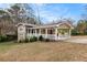 Ranch style home with covered porch and carport at 3435 Misty Valley Rd, Decatur, GA 30032
