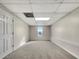 Spacious, carpeted basement with neutral walls and recessed lighting at 125 Cedars Glen Cir, Villa Rica, GA 30180