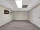 Spacious basement room with neutral walls, carpet, and a wall heater at 125 Cedars Glen Cir, Villa Rica, GA 30180
