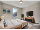Virtually staged bedroom with a comfortable bed, modern dresser, and stylish wall art at 125 Cedars Glen Cir, Villa Rica, GA 30180
