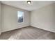 Bright and airy bedroom with neutral-colored carpet and ample natural light at 125 Cedars Glen Cir, Villa Rica, GA 30180
