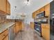 Updated kitchen with granite countertops, stainless steel appliances, and plenty of cabinet space at 125 Cedars Glen Cir, Villa Rica, GA 30180