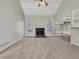 Spacious living room with a fireplace, vaulted ceiling, and large windows at 125 Cedars Glen Cir, Villa Rica, GA 30180