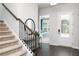 Entryway with staircase, hardwood floors, and view of study at 3006 Cambridge Mill St, Acworth, GA 30102