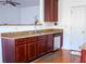 Kitchen with granite countertops and wood cabinets at 3971 Busby Mill Ct, Ellenwood, GA 30294