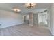 Bonus room featuring wood-look floors, shiplap wall, and two ceiling fans at 120 Woods Creek Dr, Suwanee, GA 30024