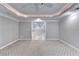 Basement bedroom with carpet, ceiling fan, and doorway leading to a tiled area at 3871 River Mansion Dr, Peachtree Corners, GA 30096