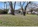 Large backyard with mature trees and partial view of home at 4251 Hamilton Mill Rd, Buford, GA 30519