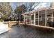 Wooden backyard deck and screened porch at 4251 Hamilton Mill Rd, Buford, GA 30519