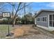Spacious backyard with patio, basketball court, and mature trees at 4251 Hamilton Mill Rd, Buford, GA 30519