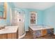 Updated bathroom featuring a corner shower and a built-in tub at 4251 Hamilton Mill Rd, Buford, GA 30519
