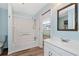 Bathroom with white tub/shower, vanity, and wood-look floors at 4251 Hamilton Mill Rd, Buford, GA 30519